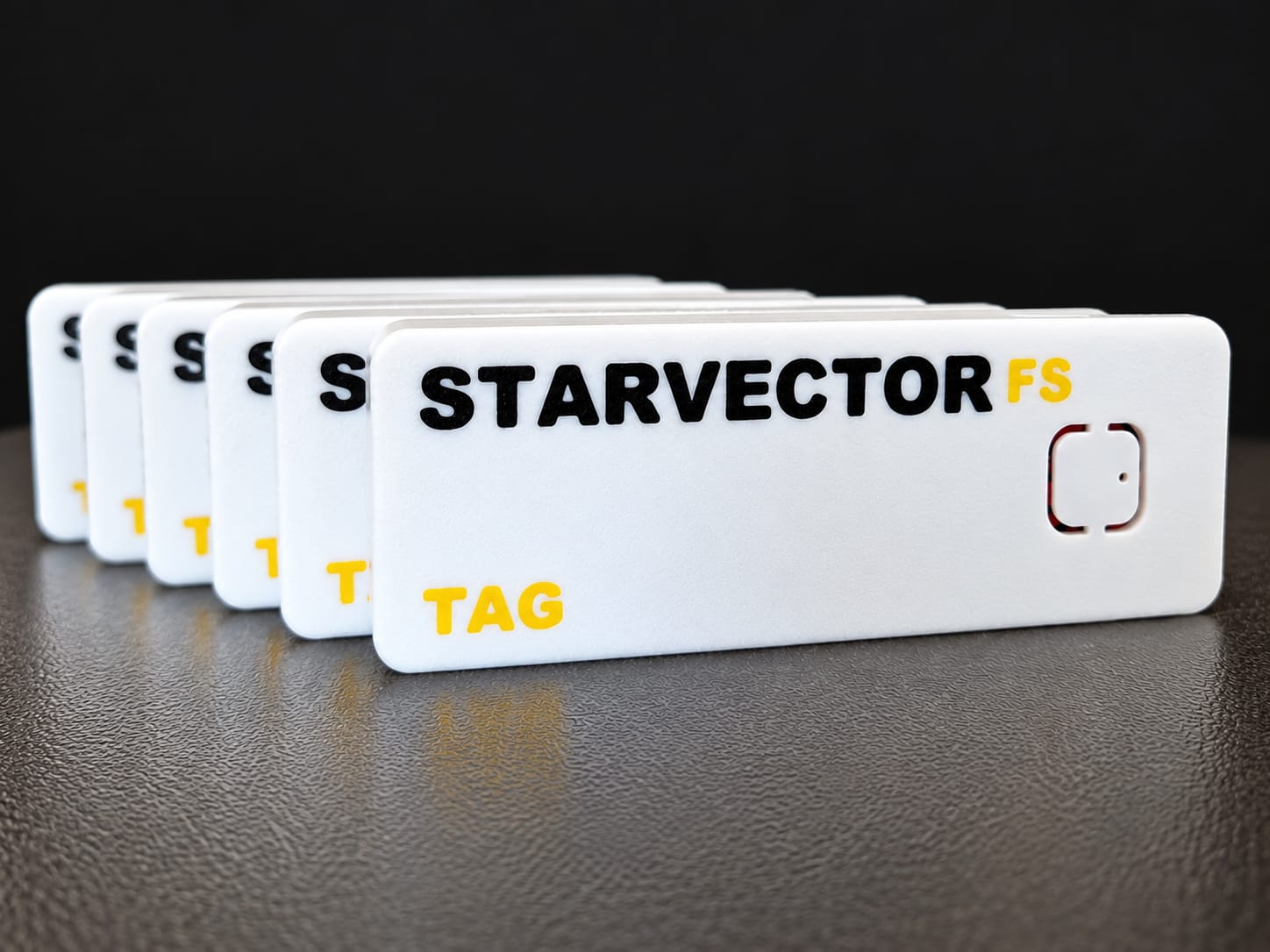 Six white STARVECTOR FS wearable tracking tags